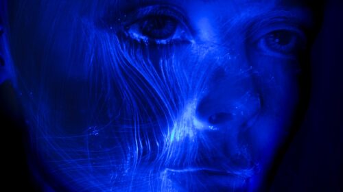 womans face with blue light