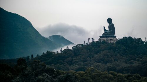 black and grey Buddha statue on top of hill